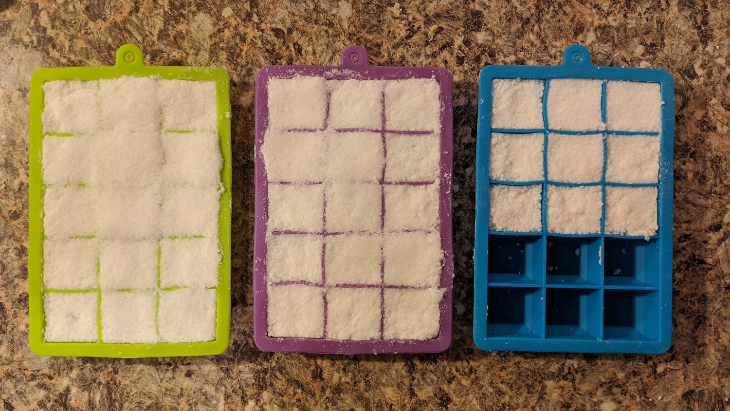 I made the mistake of overfilling the green and purple trays, which made it that much harder to unmold the tablets when they were dry. When you fill your trays, make sure the silicone separators are all visible (like in the blue tray on the right).